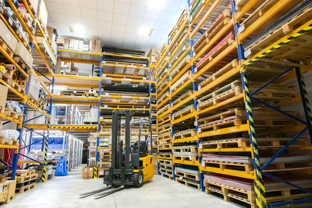 Industrial warehouse with pallet racking and a forklift